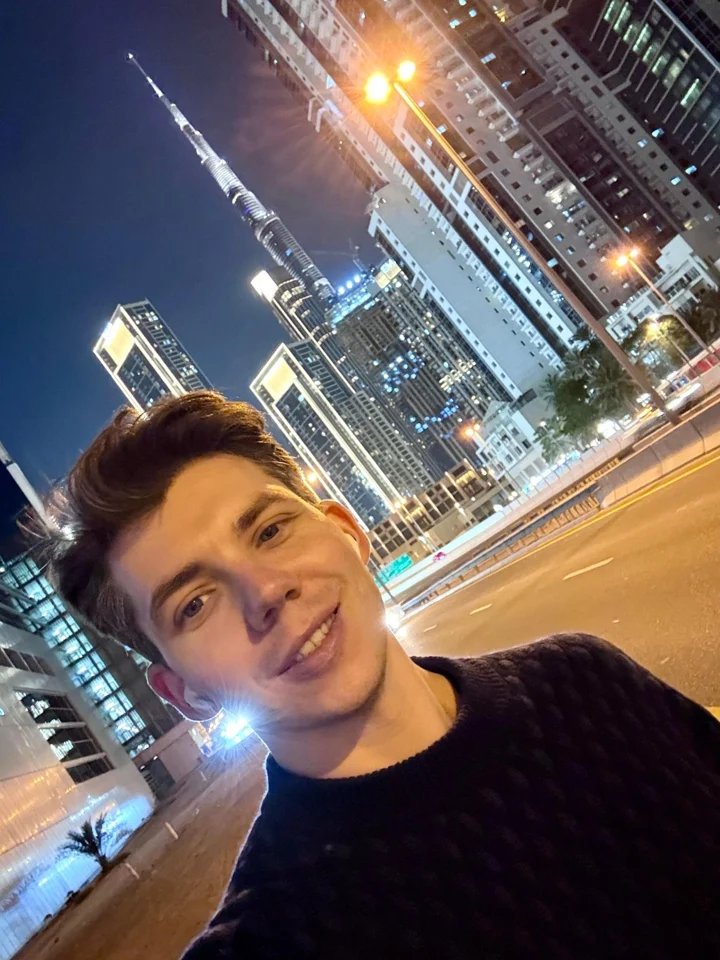 Moritz Schwarzmann in front of the Dubai skyline at night